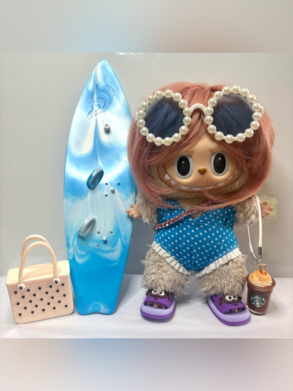3 Complete Fits, including surfer outfit and jogger set. Doll NOT included.